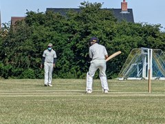 2022-07-09
St Albans III v Old Minchendenians
A fielder, wearing a mask, waits in the outfield.  Stuart Murray is the batsman. 