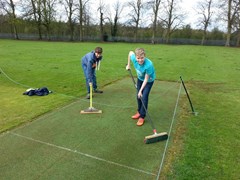 Views of Club members getting down to the business of having the ground ready for the new season.