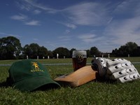 Cricket Equipment and Beer at cricket pitch