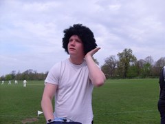 Whitey touches up his newly acquired fro.