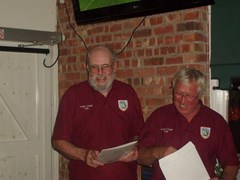 Pete presents Ken with his farewell gift, taxi fair to the airport!