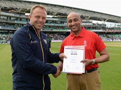 Hemal awarded his certificate from Chris Adams