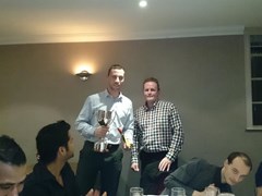 Club President, Andy Lowden, presents the Sandy Rennie club man of the year award to Stuart Dalgarno