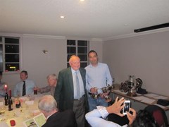 Honorary President John McHardy hands out the 1st XI awards to Aman Arora