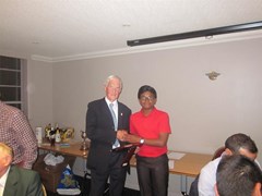 Aayush Das receives the Young Player of the Year award from Alan Innes
