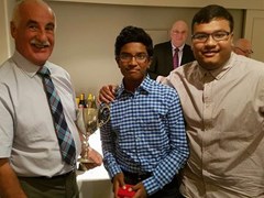 Gordonian Association Vice President Walter Stephen with the Bon Accord Cup presenting medals to Aayush & Aatish Das